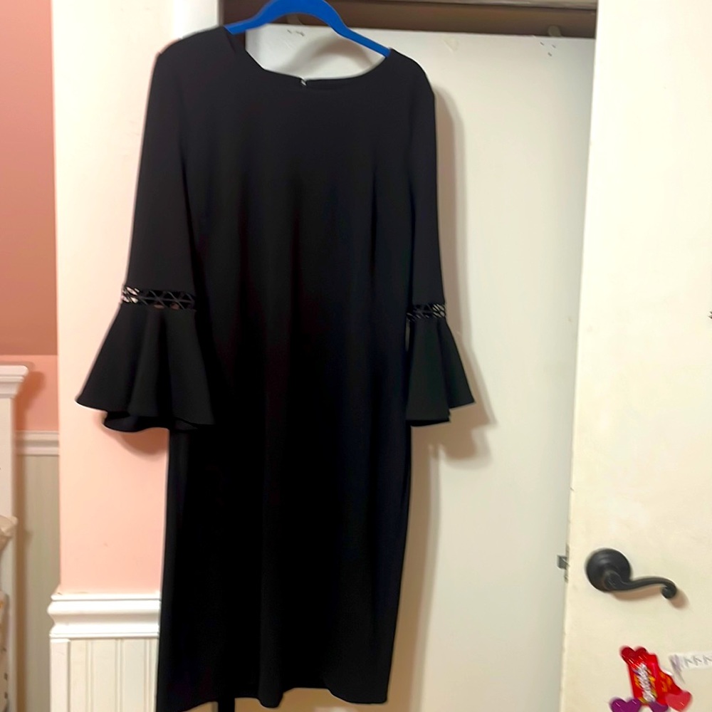 Knee length, black shift, dress, with bell sleeves and embellishment